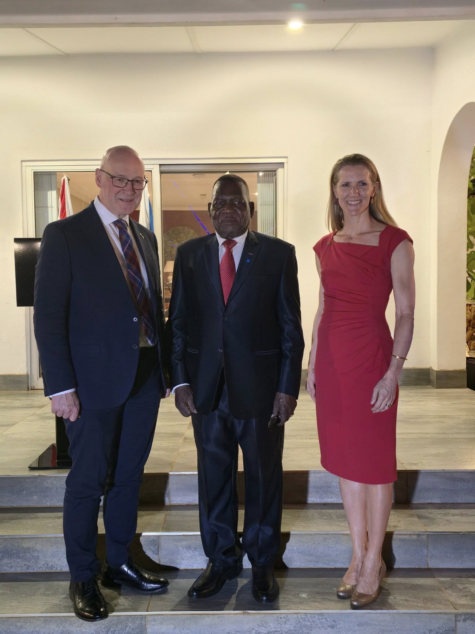 Hon Chaponda, flanked by First Minister Swinney and HE Rebecca Fabrizi